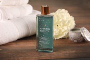 Mini lifestyle photo of bath products with yellow flower on wooden tabletop product photograph