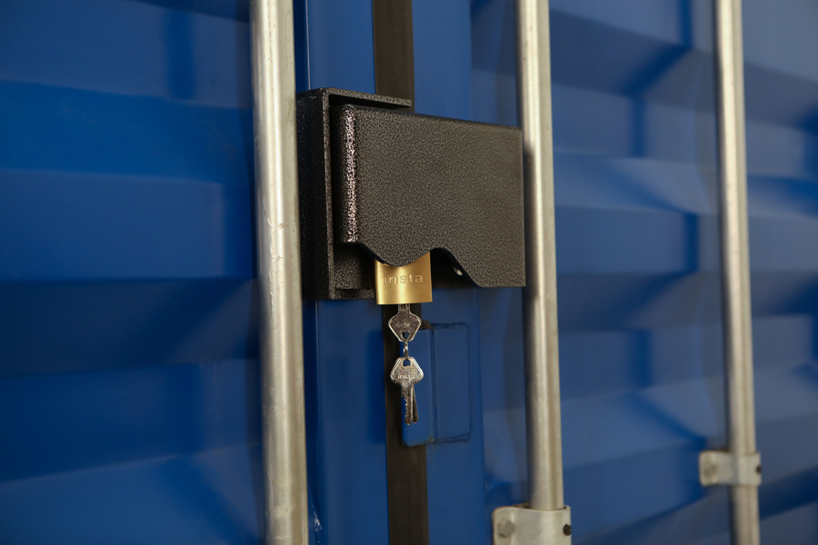 Product photo of lock box and key on a blue steel box